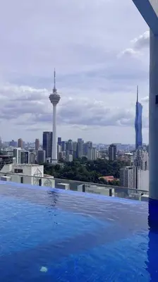 a swimming pool on top of a building with a city skyline at 3PX Suite @Colony Near Quill City Mall&Monorail in Kuala Lumpur