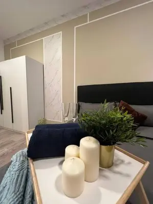 a living room with a table with candles and a couch at Idyllic Cottage 3BR Desa Park City Mont Kiara in Kuala Lumpur