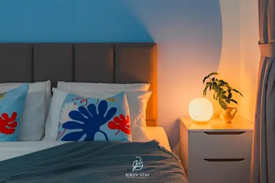 a bedroom with a bed with a blue light at RC Residences @ Sungai Besi Homestay by Birdy Stay in Kuala Lumpur