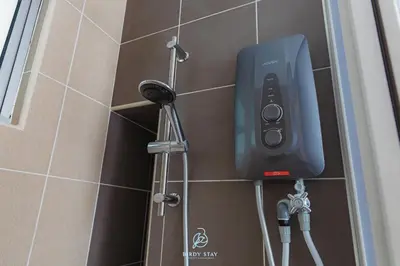 a soap dispenser on the wall of a shower at RC Residences @ Sungai Besi Homestay by Birdy Stay in Kuala Lumpur