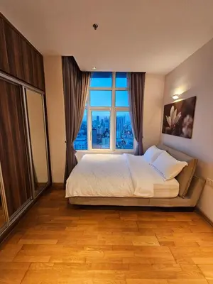 a bedroom with a large bed with a large window at Premier 2BR Suites, Dua Sentral in Kuala Lumpur