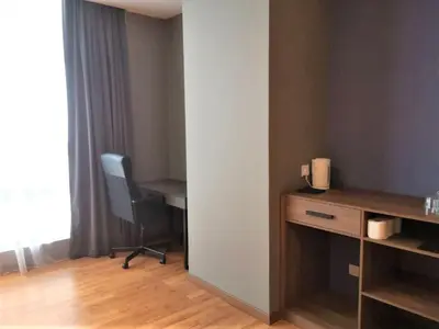 a room with a desk and a chair in a room at Imperial Suites @Bangsar by Plush in Kuala Lumpur