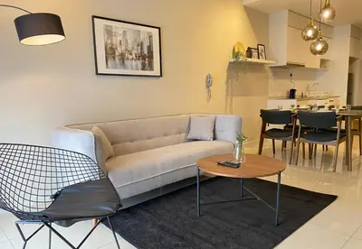 a living room with a couch and a table at Continew by Plush Services in Kuala Lumpur