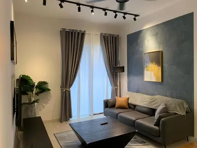 a living room with a couch and a table at Continew by Plush Services in Kuala Lumpur