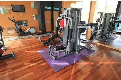 a gym with several tread machines in a room at 09-7 Sweet Home-Casa Residency in Kuala Lumpur
