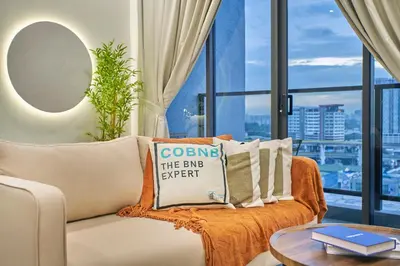 a living room with a couch and a table at Trion Kuala Lumpur by Cobnb in Kuala Lumpur