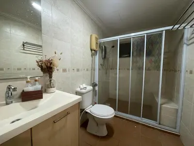 a bathroom with a shower and a toilet and a sink at Villa Wangsamas By A.Golkar in Kuala Lumpur