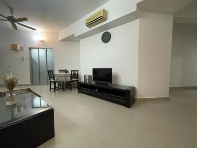 a living room with a tv and a table at Villa Wangsamas By A.Golkar in Kuala Lumpur
