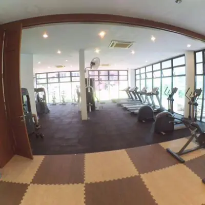 a gym with treadmills and ellipticals in a room at Villa Wangsamas By A.Golkar in Kuala Lumpur