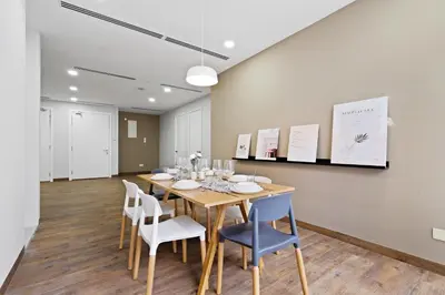 a dining room with a table and chairs at Binjai 8 by Plush in Kuala Lumpur