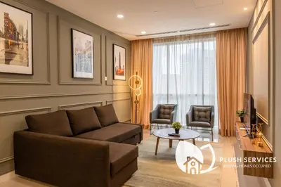 a living room with a couch and a table at Binjai 8 by Plush in Kuala Lumpur