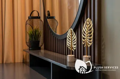 a black railing with a table with plants on it at Binjai 8 by Plush in Kuala Lumpur
