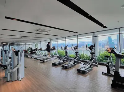 a gym with a bunch of treadmills and machines at 7PX 2BR Family Gathering Loft @ Colony, Near Quill City Mall & Monorail in Kuala Lumpur