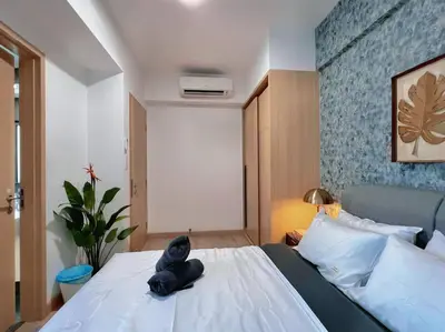 a stuffed animal sitting on a bed in a bedroom at 4PX Loft @ Colony, Near Quill City Mall & Monorail in Kuala Lumpur