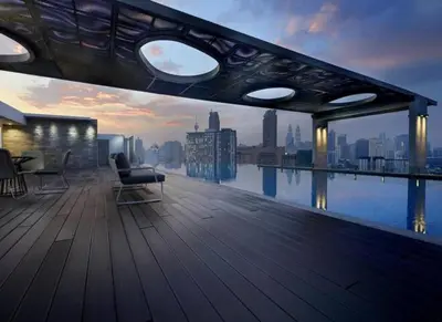 a balcony of a building with a view of the city at Cozy Suites @ D’majestic Place, KL City Centre in Kuala Lumpur