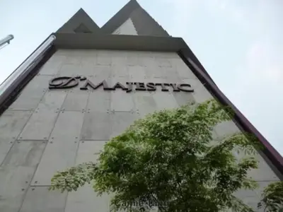 a building with a sign on the side of it at Cozy Suites @ D’majestic Place, KL City Centre in Kuala Lumpur