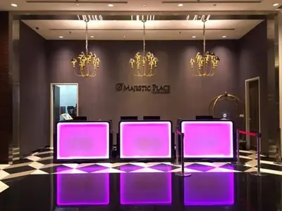 a group of purple chairs in a room with chandeliers at Cozy Suites @ D’majestic Place, KL City Centre in Kuala Lumpur