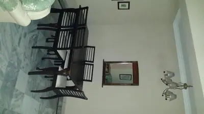 a black spiral staircase in a room with a mirror at Golden City Apartment - Leisure Holiday Resorts in Kuala Lumpur
