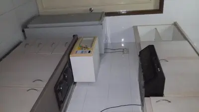 a kitchen with a sink and a stove top oven at Golden City Apartment - Leisure Holiday Resorts in Kuala Lumpur