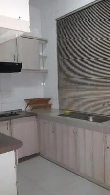 a kitchen with a sink and a window at Golden City Apartment - Leisure Holiday Resorts in Kuala Lumpur