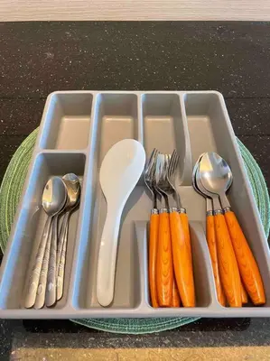a tray filled with utensils and silver ware at Kids Friendly Kuala Lumpur Apartment in Kuala Lumpur