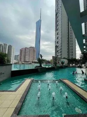 a group of ducks in a swimming pool in a city at Kids Friendly Kuala Lumpur Apartment in Kuala Lumpur