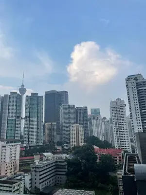 a view of a city with tall buildings at Kids Friendly Kuala Lumpur Apartment in Kuala Lumpur