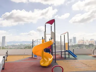 a playground with a slide on a roof at Cozy 2-bed retreat - F&B Mart - Chan Sow Lin in Kuala Lumpur