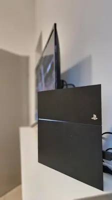 a computer monitor sitting on top of a desk at Mimi Cozy Homestay, 3R3B KLCC View with PLAYSTATION 4, NETFLIX, WiFi 6, Pool Table, Home Cinema in Kuala Lumpur