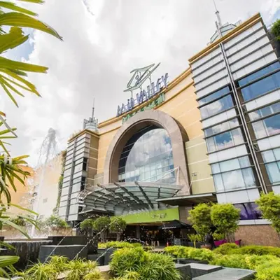 a building with a sign on top of it at Mimi Cozy Homestay, 3R3B KLCC View with PLAYSTATION 4, NETFLIX, WiFi 6, Pool Table, Home Cinema in Kuala Lumpur