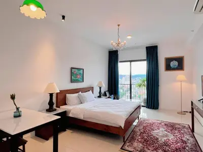 a bedroom with a bed and a large window at KLCC View with Balcony @ Chambers, KL Near LRT PWTC & Sunway Putra Mall in Kuala Lumpur