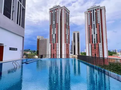 a large swimming pool on top of a building with tall buildings at KLCC View with Balcony @ Chambers, KL Near LRT PWTC & Sunway Putra Mall in Kuala Lumpur