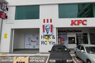 a kfc store with cars parked outside of it at Lovely Family Suites at Razak City by HCK in Kuala Lumpur