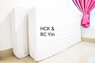 a white book with a pink ribbon on it at Lovely Family Suites at Razak City by HCK in Kuala Lumpur