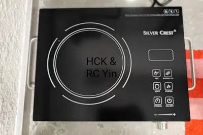 a close up of a microwave oven with a dial at Lovely Family Suites at Razak City by HCK in Kuala Lumpur