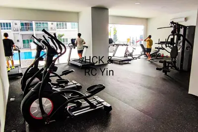 a gym with people working out in the gym at Lovely Family Suites at Razak City by HCK in Kuala Lumpur