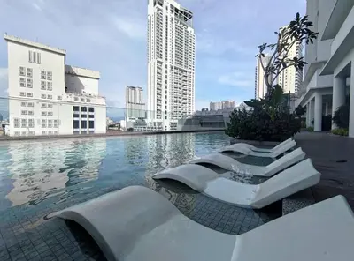 a pool in a city with tall buildings at Quill Residences KL By Minos Home in Kuala Lumpur