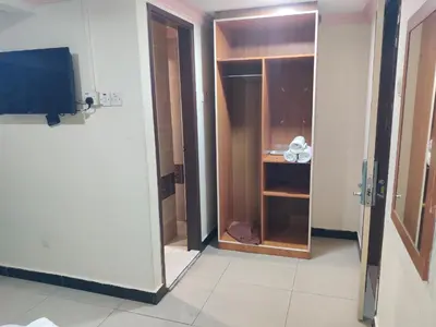 a door to a closet in a room at Hotel WKL in Kuala Lumpur