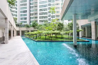 a swimming pool in the middle of a building at Spacious Home for 6pax - Regalia Suite - Infinity Pool with KL City View - Free Wi-Fi & Parking in Kuala Lumpur