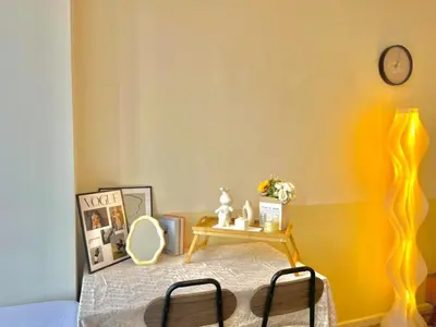 a bedroom with a bed and a table with a mirror at KLCC VIEW,5 mins to KL TOWER in Kuala Lumpur