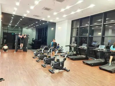 a group of people exercising in a gym at Chambers Residence KLCC By Purple Orchid in Kuala Lumpur