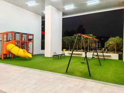 a play area with a slide and a playground at Chambers Residence KLCC By Purple Orchid in Kuala Lumpur