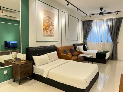 a bedroom with two beds and a living room with a couch at Chambers Residence KLCC By Purple Orchid in Kuala Lumpur