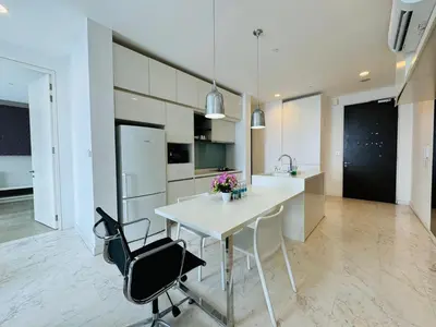 a kitchen with a white table and two chairs at Platinum suites by BLUE SKY in Kuala Lumpur
