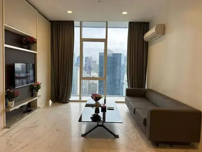 a living room with a couch and a large window at Platinum suites by BLUE SKY in Kuala Lumpur