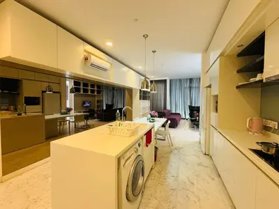 a kitchen with a washing machine in the middle of a room at Platinum suites by BLUE SKY in Kuala Lumpur