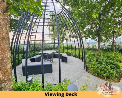 a swinging cage with chairs and a table in a garden at Trion @ Kuala Lumpur near KLCC TRX by Cityscape in Kuala Lumpur