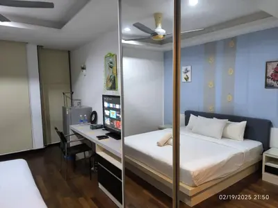 a bedroom with a bed and a desk with a computer at Sweet Home-0263A-Casa Residency in Kuala Lumpur
