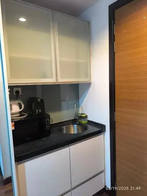 a small kitchen with a sink and a microwave at Sweet Home-0263A-Casa Residency in Kuala Lumpur