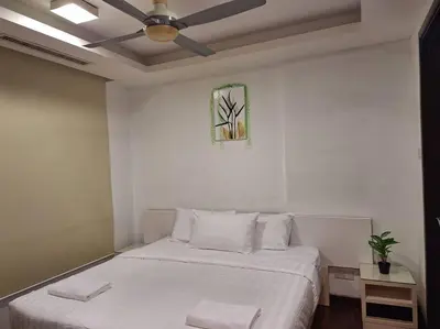 a white bedroom with a bed and a ceiling fan at 026-3A Sweet Home-Casa Residency 2R 2B in Kuala Lumpur